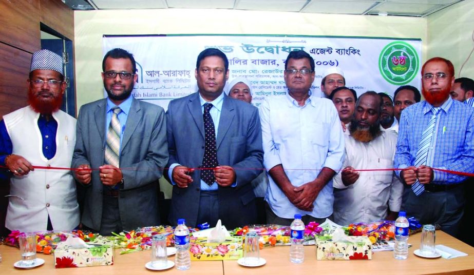 Deputy Managing Director of Al-Arafah Islami Bank Limited Md. Rezaur Rahman inaugurating new agent banking outlet at Kalir Bazaar, Comilla recently.