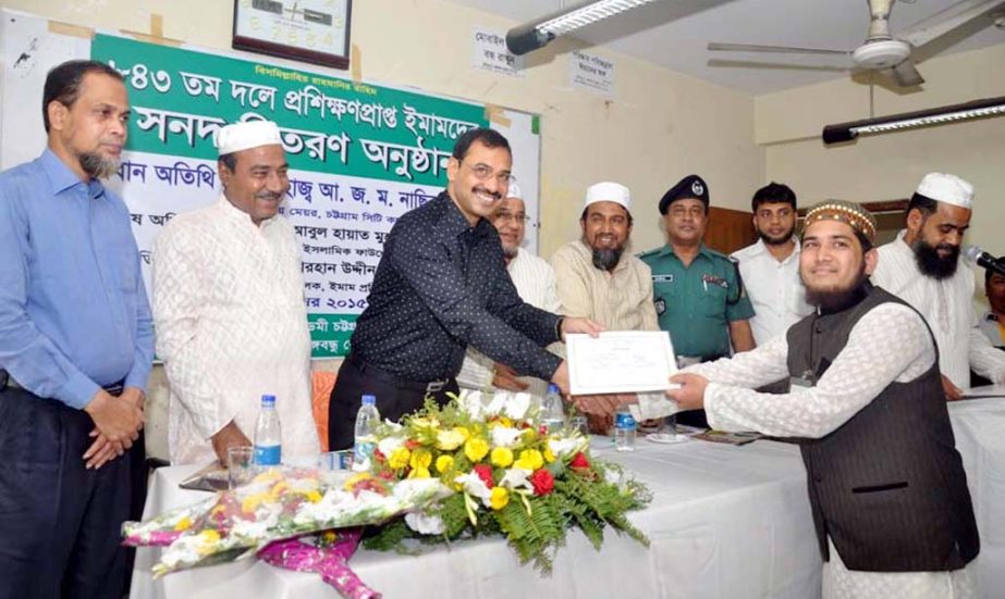 CCC Mayor AJM Nasir Uddin distributing certificates among the trainee imams at Pahartali Haji Camp Imam Training Academy in the city on Wednesday.