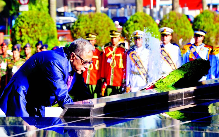 President Abdul Hamid paying tributes to the members of the Armed Forces and freedom fighters who sacrificed their lives during the Liberation War by placing floral wreaths at Shikha Anirban (Eternal Flame) at Dhaka Cantonment on Saturday on the occasion