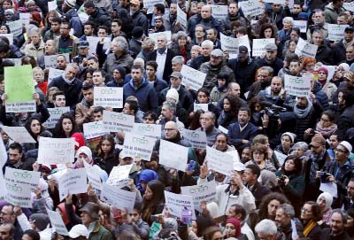 Demonstrators attend a protest called "Not in my name" of Italian muslims against terrorism in downtown Milan, Italy on Saturday.