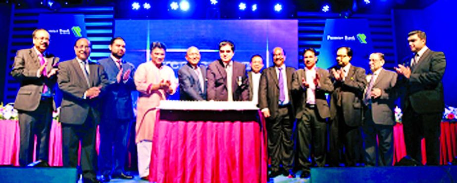 Commerce Minister Tofail Ahmed, MP cutting a cake to celebrate the 16th years anniversary of Premier Bank Limited at a city hotel recently. Mayor Dhaka Uttar Annisul Huq, Bangladesh Bank Deputy Governor SK Sur Chowdhury and Chairman Dr HBM Iqbal of the b