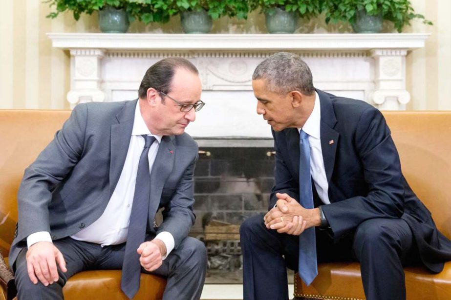 President Barack Obama meets with President Francois Hollande of France in the Oval Office of the White House in Washington on Tuesday.