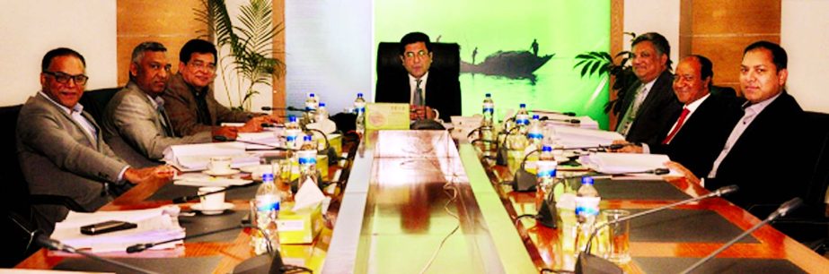 Barrister Sheikh Fazle Noor Taposh MP, Chairman of the Executive Committee of Modhumoti Bank Limited, presiding over its 35th meeting at the bank's head office.