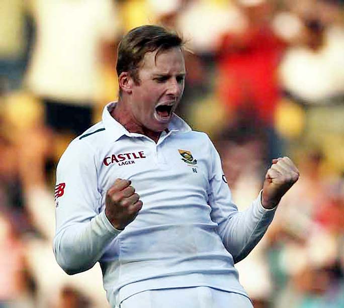 South African cricketer Simon Harmer celebrates the dismissal of Amit Mishra, India's last wicket on the first day of the third Test cricket match between the two countries in Nagpur, India on Wednesday.