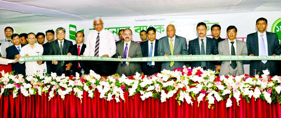 Md. Badiul Alam, Managing Director (Current Charge) of National Bank Limited, inaugurating its 182nd branch at Sonargaon Janapath, Uttara in the city on Thursday. AFM Shariful Islam, Additional Managing Director, Syed Mohammad Bariqullah and ASM Bulbul, D