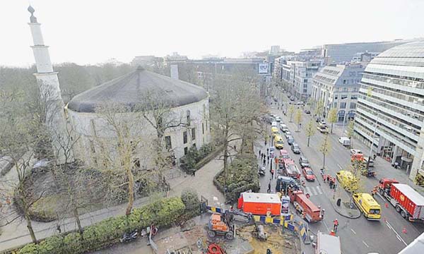 The picture shows ambulances, police and fire-fighting vehicles outside the Brussels mosque after a suspect letter with power was found on Thursday.