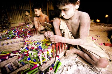 The street children are working in an unhealthy atmosphere at a balloon factory in the old part of capital city Dhaka.