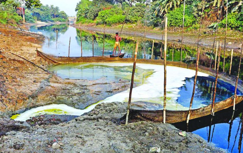 Industrial chemical waste in liquid form flows into a canal connected with Sitalakkhya River polluting the water and destroying the fish. This photo was taken from Shimrail of Siddhirganj in Narayanganj on Friday.