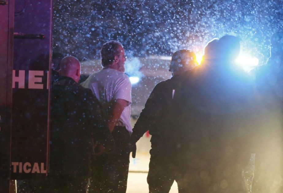 A suspect is taken into custody outside a Planned Parenthood center in Colorado Springs, November 27, 2015. REUTERSIsaiah J. Downing