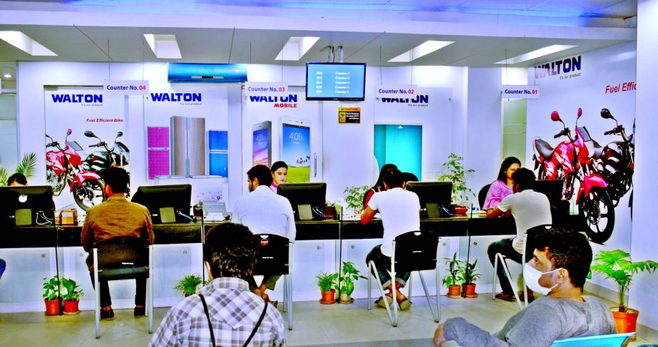 The picture shows the officials of a Walton service center are delivering necessary services to the desired clients at a sales service centre in the city on Saturday.