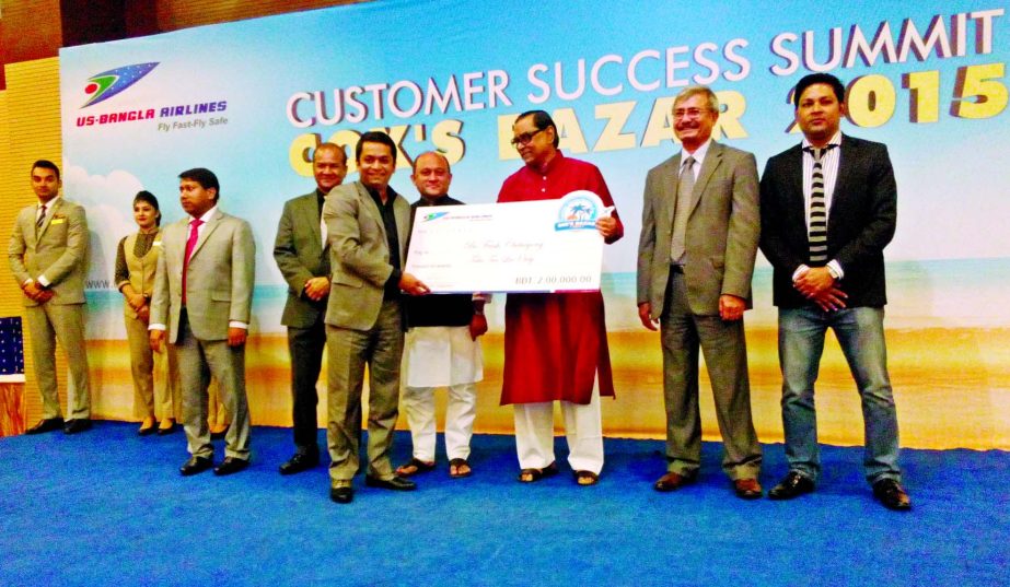 Civil Aviation and Tourism Rashed Minister Rashed Khan Menon presenting Champion of the Nationwide Best Seller Award to a travel agency in 'Customer Success Summit' at Ocean Paradise Hotel at Cox's Bazar recently.