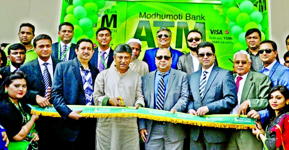 Noor-E-Alam Chowdhury, MP, inaugurating the 15the branch of Modhumoti Bank Limited at Shibchar, Madaripur on Sunday. Humayun Kabir, Chairman of the Board of Directors of the bank presided.