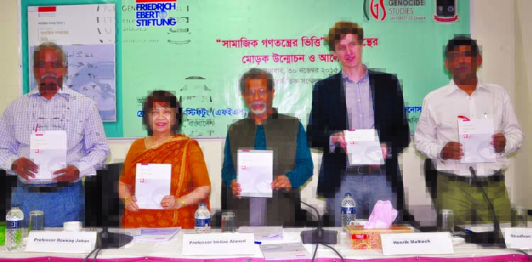 Educationist Prof Dr Imtiaz Ahmed, along with other distinguished persons holds the copies of a book titled 'Foundation of Social Democracy' at its cover unwrapping ceremony organized by Friedrich Ebert Stiftung, Dhaka at CIRDAP auditorium in the city o