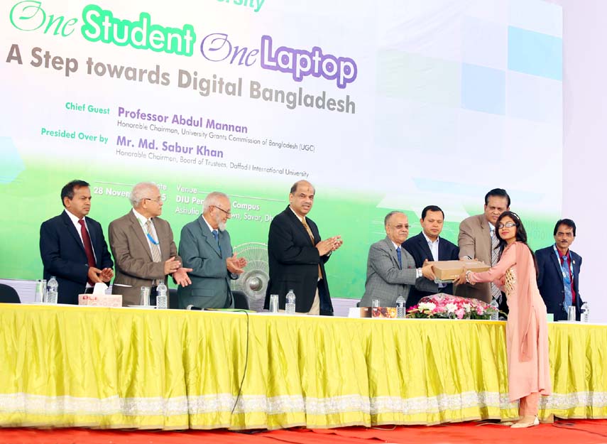 UGC Chairman Prof Abdul Mannan distributing laptops among the students at Daffodil International University on Saturday.