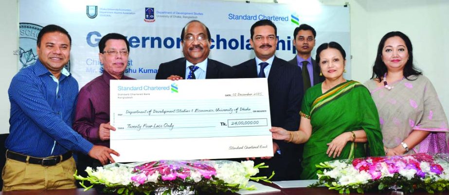 SK Sur Chowdhury, Deputy Governor of Bangladesh Bank and Abrar A. Anwar, Chief Executive Officer of SCB handing over the cheque of 'Governor Scholarship' to Dhaka University Professor Dr. M. Abu Eusuf, Chairman, Department of Development Studies in Prof