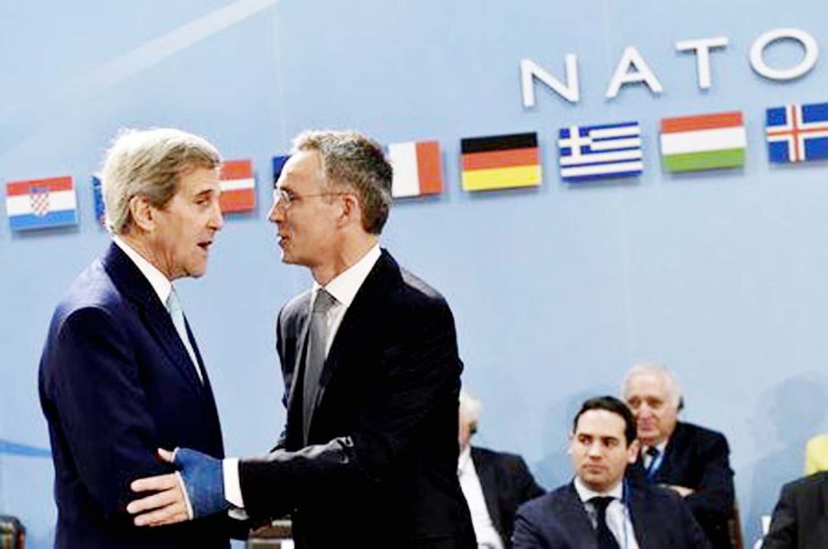 NATO Secretary-General Jens Stoltenberg welcomes US Secretary of State John Kerry (L) during a NATO foreign ministers meeting at the Alliance headquarters in Brussels, Belgium, on Wednesday.