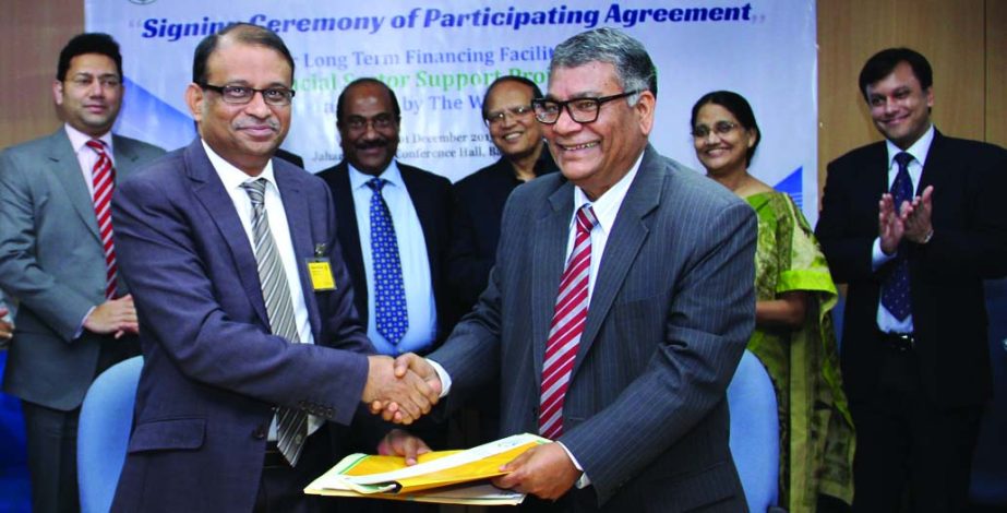 Eastern Bank Ltd (EBL) Managing Director and CEO Ali Reza Iftekhar and Md. Ahsan Ullah, Executive Director of Bangladesh Bank and Project Director of World Bank funded Financial Sector Support Projects (FSSP) exchanging documents after signing a participa