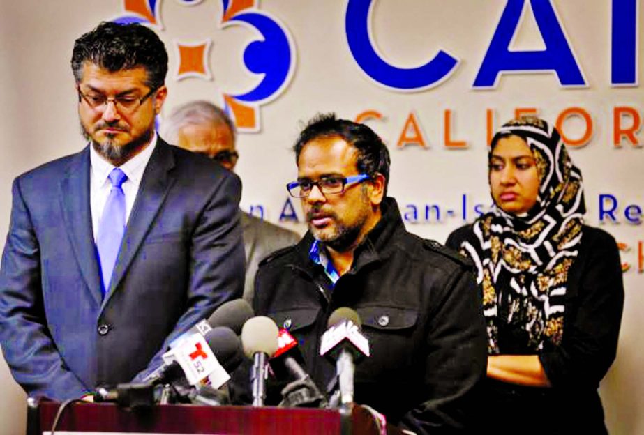 Farhan Khan (C), brother-in-law of San Bernardino shooting suspect Syed Farook, is consoled by LA Executive Director of the Council on American-Islamic Relations Hussam Ayloush during a news conference in Anaheim, California.