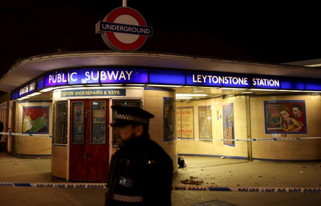 Police officers investigate a crime scene at Leytonstone underground station in east London, Britain December 6, 2015