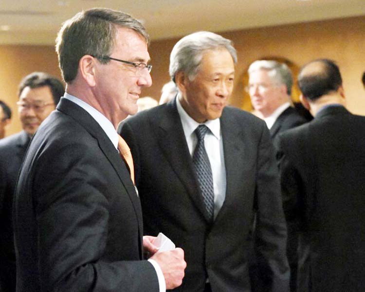 US Secretary of Defensce Ashton Carter (L) chats with Singapore minister for defence Ng Eng Hen during the 14th Asia Security Summit, the International Institute for Strategic Studies (IISS) Shangri-La Dialogue, in Singapore. AP file photo
