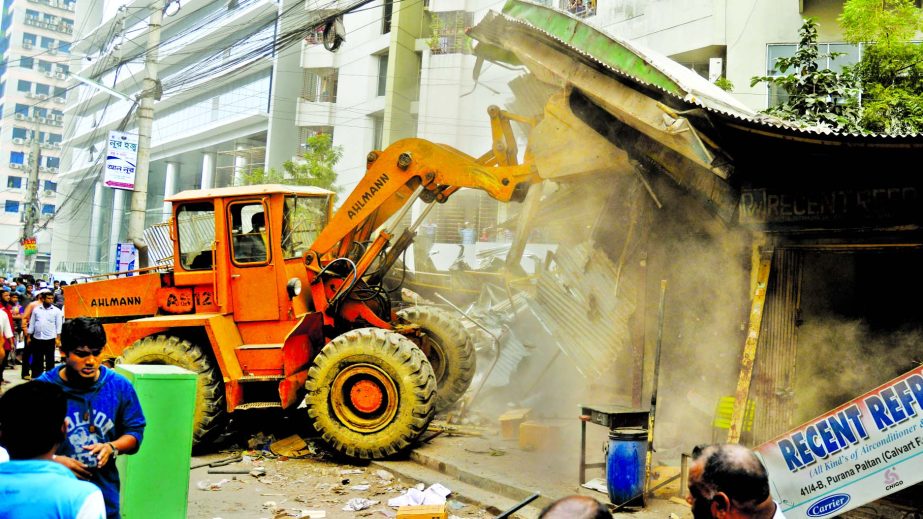 Rajuk continues eviction of illegal structures in city. This photo was taken from Culvert Road in Fakirerpool area on Tuesday.