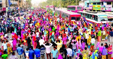 Agitated RMG workers block road for five hours in city's Arambagh area on Tuesday demanding compensation for killing of a female worker in road accident on Monday night.