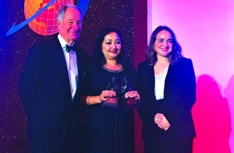 Bitopi Das Chowdhury, Country Head of Corporate Affairs of Standard Chartered Bangladesh seen holding the "Bank of the Year" award alongside officials from The Bankers at the recently held Grand Gala Award Ceremony in London.