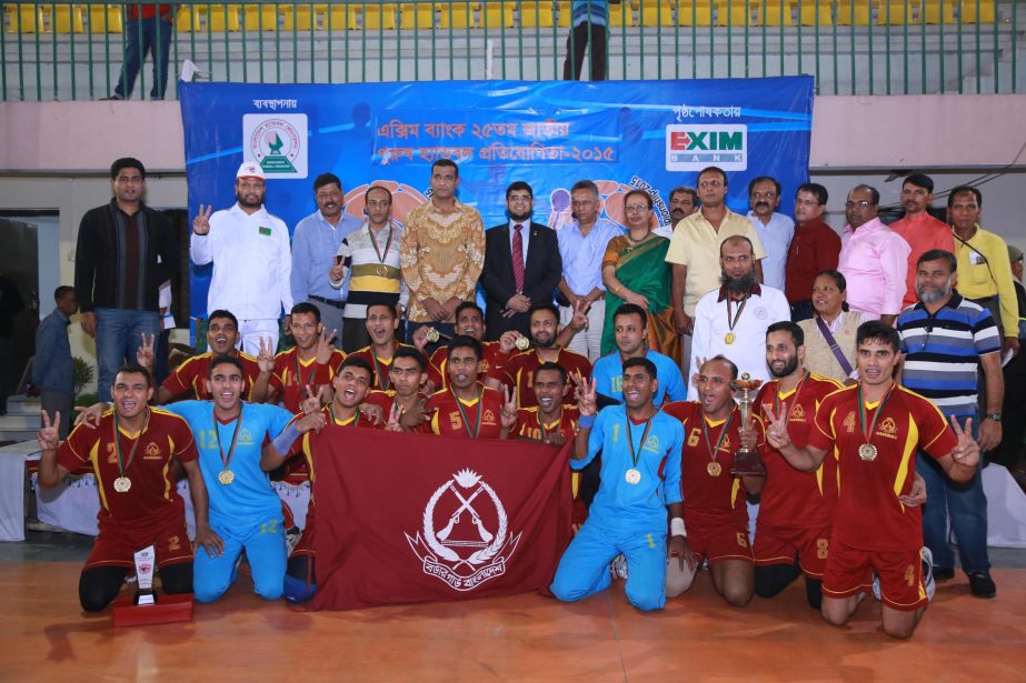 Members of Border Guard Bangladesh, the champions of the EXIM Bank 25th National Men's Handball Championship with the chief guest and the officials of Bangladesh Handball Federation pose for a photograph at the Shaheed (Captain) M Mansur Ali National Han
