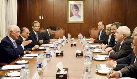 Iranian Foreign Minister Javad Zarif (3rd R) meets with advisor to Pakistan's Prime Minister on National Security and Foreign Affairs Sartaj Aziz (L) at the Heart of Asia meeting in Islamabad, Pakistan