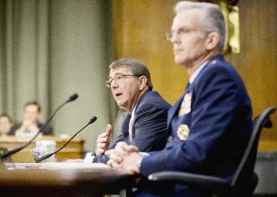 Defense Secretary Ash Carter, accompanied by Joints Chiefs Vice Chairman Gen. Paul Selva, testifies on Capitol Hill in Washington on Wednesday before the Senate Armed Service Committee.