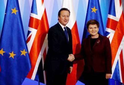 Britain's Prime Minister David Cameron shakes hands with his Polish counterpart Beata Szydlo during their meeting in Warsaw, Poland on Thursday.