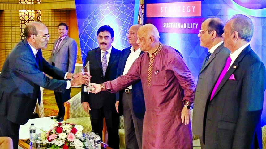 Finance Minister Abul Maal Abdul Muhith, MP handing over the ICAB National Award in Private Sector Banks for Best Presented Annual Reports-2014 to Mohammed Shahid Ullah ACA, Executive Vice President & CFO of Islami Bank Bankgladesh Limited at Bangabandhu