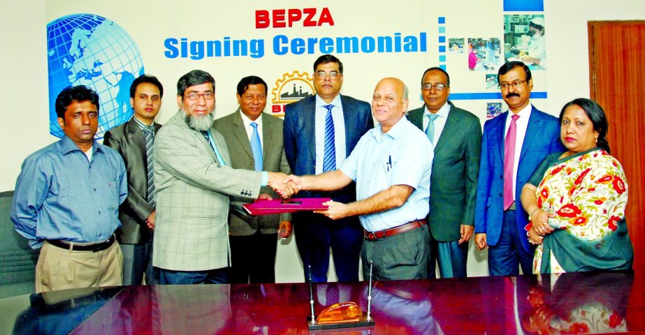 Sayed Nurul Islam, Member (IP) of BEPZA and Prem Soni, Director (Finance) of Ms Epic Apparels Co Ltd sign an agreement in BEPZA Complex, Dhaka recently for establishing a Hong Kong-Indian RMG industry in Ishwardi EPZ with an investment of US$ 19.55 Milli
