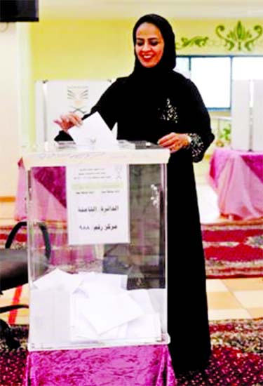 A Saudi woman casts her ballot in Jeddah. Internet