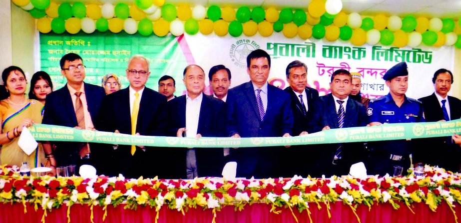 Syed Moazzem Hussain, Director, Board of Directors of Pubali Bank Ltd. inaugurating its its 438th branch at Torki Bondor, Barisal recently.