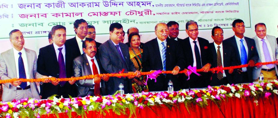 Kazi Akram Uddin Ahmed, Chairman of Standard Bank Ltd. inaugurating Kadamtoli Branch at Chittagong recently. Md. Nazmus Salehin, Managing Director, Vice-Chairman of Kamal Mostafa Chowdhury, Directors Ashok Kumar Saha, Ferozur Rahman, S. A. M. Hossain, Moh