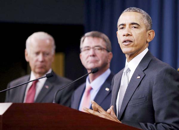 US President Barack Obama delivers remarks after attending a National Security Council meeting on the counter-Islamic State campaign accompanied by US Vice President Joe Biden (L) and U.S. Defence Secretary Ash Carter (C) at the Pentagon in Washington.