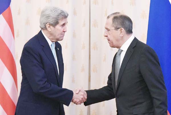 Russian Foreign Minister Sergei Lavrov shakes hands with US Secretary of State John Kerry during their meeting in Moscow on Tuesday.