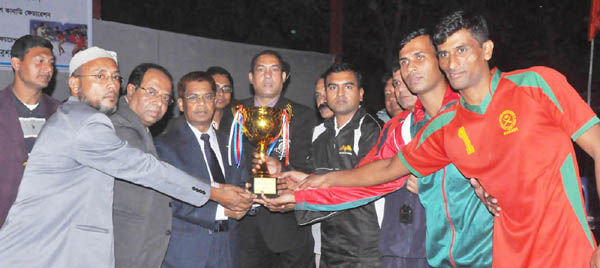 President of Bangladesh Kabaddi Federation and Inspector General of Bangladesh Police AKM Shahidul Haque handing over the championship trophy to Bangladesh Army, which team emerged as the champions of the Victory Day Kabaddi Competition at the Kabaddi Sta