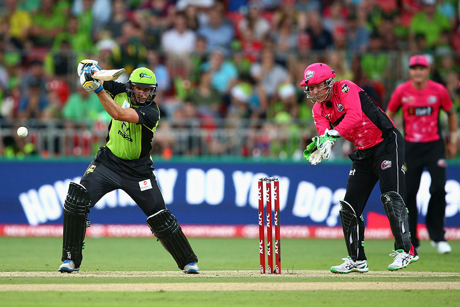 Michael Hussey steers the ball through the off-side during his unbeaten 80 during the Big Bash League between Sydney Thunder and Sydney Sixers at Sydney on Thursday.