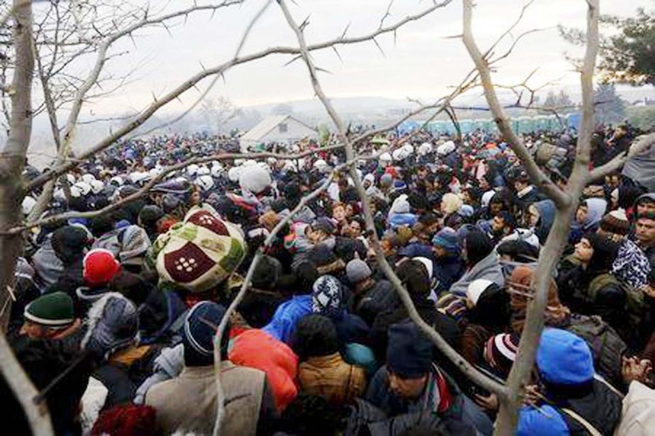 Refugees wait to cross the Greek-Macedonian border near the village of Idomeni, Greece.