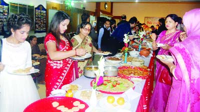 SYLHET: Visitors enjoying a Cake Mela organied by Sylhet Station Club Ltd recently.