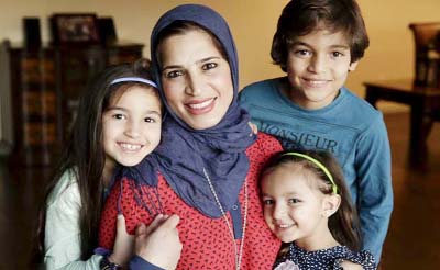 Mirvette Judeh poses for a photo with her children, Ayah Maaytah (L-R), 7, Salma Maaytah, 3, and Rakan Maaytah, 9, at their home in Buena Park, California