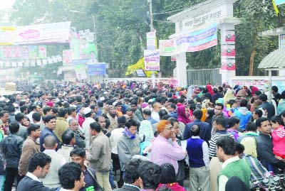 BOGRA: Guardians in Bogra are waiting anxiously during admission test of government schools of class III. This picture was taken from Bogra Govt Girls' School premises yesterday.