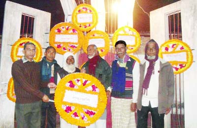 SAPAHAR(Naogaon): Members of Goyala Probin Kallyan Sangstha, Sapahar placing wreaths at Shaheed Smriti Monument on the occasion of the Victory Day on Wednesday.