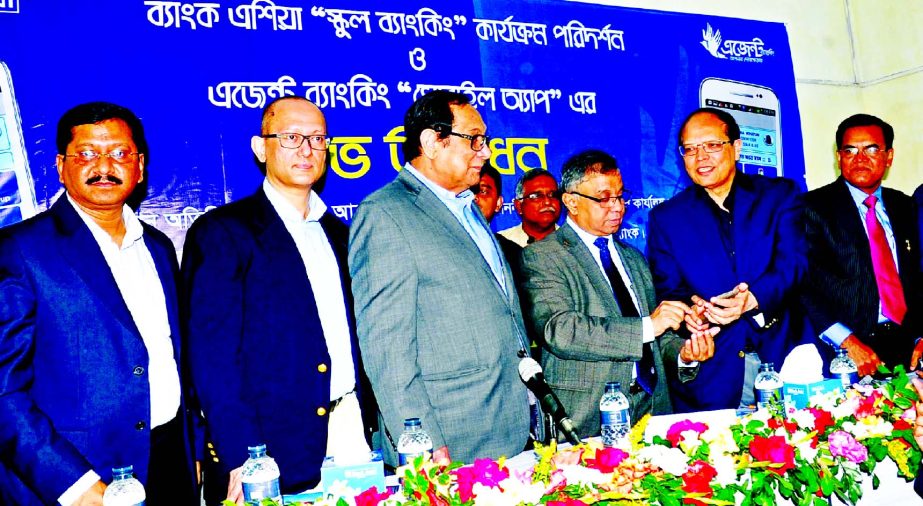 Md Abul Kalam Azad, Principal Secretary of Prime Ministers' office, inaugurating the Bank Asia Agent Banking "Mobile Apps" service on Saturday at Rajdia Ovoy Pilot High School, Serajdikhan in Munshigonj. Dr Atiur Rahman, Governor of Bangladesh Bank was