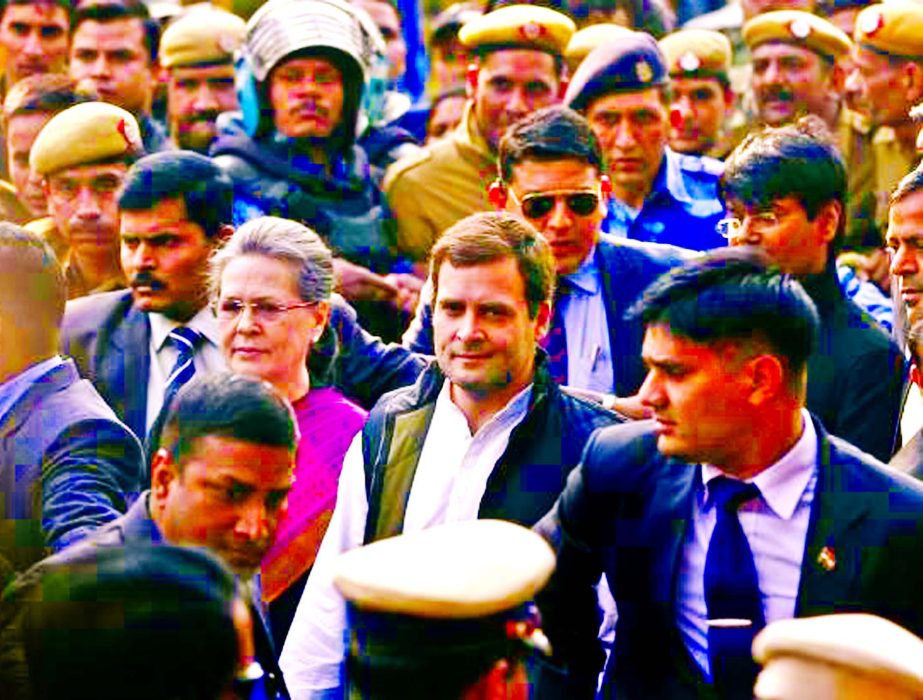 Congress party president Sonia Gandhi (C-L) and her son and the party's vice-president Rahul Gandhi, arrive at a court in New Delhi, India on Saturday (Dec 19).