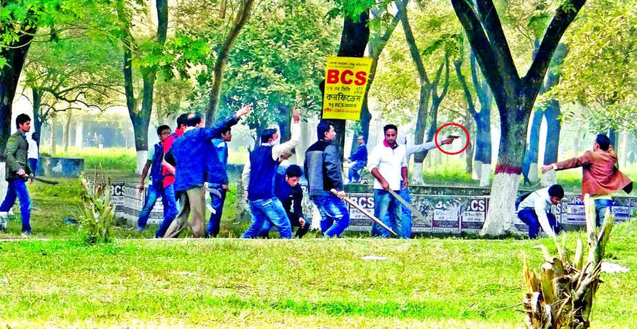 Armed BCL rivals attacked each other at the Islamic University on Saturday. Photo shows besides lethal weapons some are using fire arms.