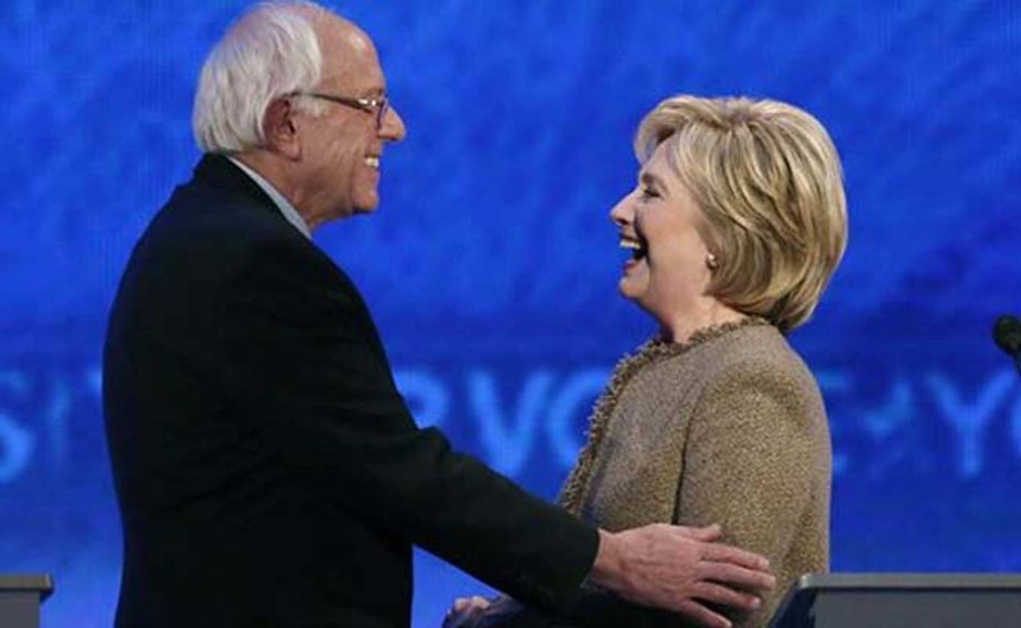 US Democratic presidential candidate Bernie Sanders greeting front-runner Hillary Clinton at a Democratic presidential primary debate at Saint Anselm College in Manchester on Saturday.