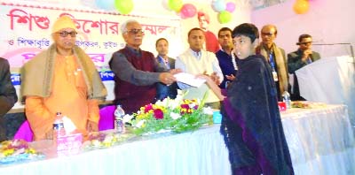 FENI: Aziz Ahmed Chowdhury, District Administrator, Feni Zilla Parishad distributing prizes at Shishu-Kishore Sammelon organised by Bibekanando Shikkha and Sangskritik Parishad in Feni.